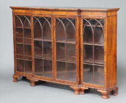 A 19th Century mahogany triple breakfront bookcase fitted shelves enclosed by arch shaped astragal