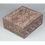 A 19th Century rectangular deeply carved camphor box with hinged lid and fall front, the interior