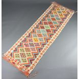 A white, green and yellow ground Chobi, Kilim runner with all over diamond design 244cm x 76cm