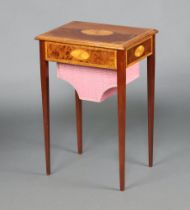 An Edwardian style rectangular inlaid mahogany work table with hinged lid and deep basket, raised on