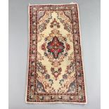 A white and floral patterned Persian rug with centre medallion 127cm x 60cm Some stains in places
