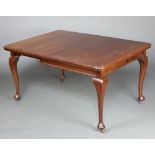 A 19th/20th Century mahogany extending dining table with 1 extra leaf, on cabriole supports 76cm h x