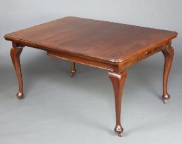 A 19th/20th Century mahogany extending dining table with 1 extra leaf, on cabriole supports 76cm h x