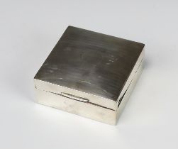 A silver engine turned cigarette box Birmingham 1922, 9cm, Numerous dents