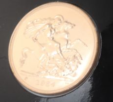 A five pound brilliant uncirculated coin 1984