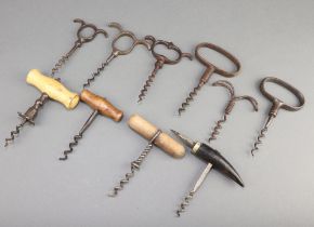 Four 19th Century eyebrow handle corkscrews, a Farrow and Jackson All Fire steel corkscrew and 5