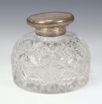 A Victorian cut glass inkwell with a silver lid London 1893, 10cm The lid is squashed and there