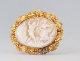 A yellow metal etruscan style oval cameo brooch decorated with dancing figures 4cm, gross weight 6.4