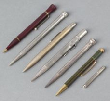 A silver propelling pencil, 5 other pencils