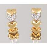 A pair of 18ct yellow gold diamond set heart earrings, the 6 brilliant cut diamonds each approx.