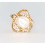 A yellow metal 585 natural pearl ring set with diamonds 7.6 grams, size O 1/2