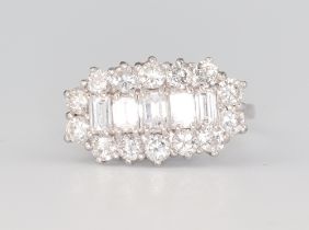 An 18ct white gold baguette and brilliant cut diamond cocktail ring, approx. 2ct, size N 1/2, 5.4