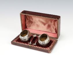 A pair of Edwardian novelty silver plated salts in the form of walnut shells with spoons, cased