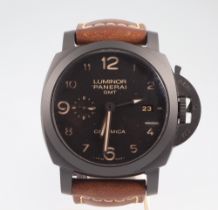 A gentleman's Panerai Luminor GMT Ceramica wristwatch with black face and date aperture and