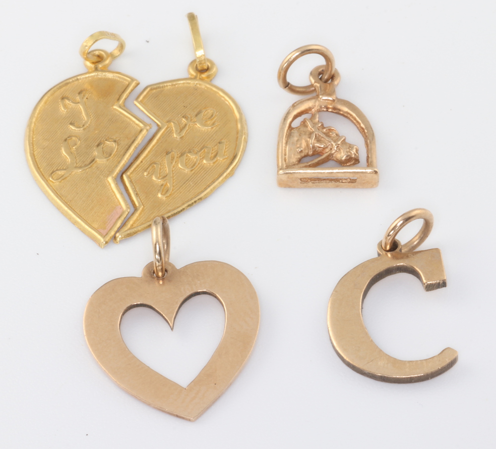 Three 9ct yellow gold charms 3.2 grams, 2 yellow metal 18ct charms 1.6 grams