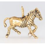 A G & G Appleby limited edition yellow metal 18k charm in the form of a zebra, set with a 0.10ct