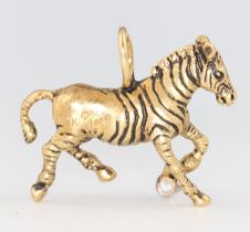 A G & G Appleby limited edition yellow metal 18k charm in the form of a zebra, set with a 0.10ct