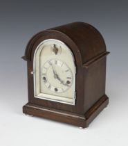 An Edwardian striking bracket clock with 10cm arched silvered dial, Roman numerals, striking on 5