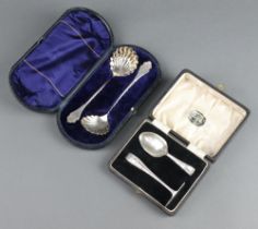 A silver pusher and spoon Birmingham 1934, 2 silver serving spoons Sheffield 1889, both cased 88