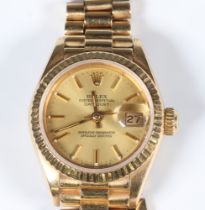 A lady's 18ct yellow gold Rolex Oyster Perpetual Datejust wristwatch on a 18ct yellow gold President