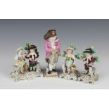 A pair of Sitzendorf figures of a girl and boy with sheep on Rococo bases 10cm (1 stuck, both are