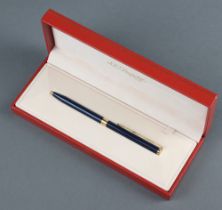 A lady's gilt and blue lacquered ballpoint pen boxed