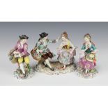 A Sitzendorf group of a seated lady and gentleman on a Rococo base 15cm and a pair of Samson figures