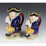 19th Century Staffordshire Toby jug of a seated man holding a mug of beer with original hat 25cm,