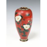 A Chinese red ground cloisonne enamelled vase with floral and butterfly decoration, 18cm h Cracks in