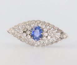 An Art Deco white metal, sapphire and diamond brooch, the centre sapphire approx. 1.5ct, 6.7