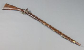 A 19th Century percussion musket, the barrel with crows foot mark and tower lock plate Stock is