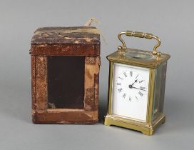 A 19th Century French carriage timepiece with 5cm enamelled dial, Roman numerals contained in a gilt