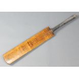 A Sandham Strudwick cricket bat bearing the signatures of the 1934 England and Australian eleven