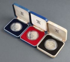 Three silver commemorative coins 1977, 1980 and 1981, 84 grams, cased