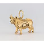 A G & G Appleby limited edition yellow metal 18k diamond charm in the form of a rhinoceros, set with