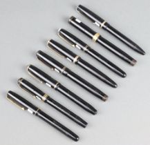 A Parker Duofold black fountain pen with 14ct gold nib and 7 various fountain pens