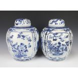 A pair of Chinese blue and white jars and covers decorated with panels of figures in gardens, panels