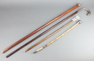 A Continental walking stick with white metal handle, a cane swagger stick and stick