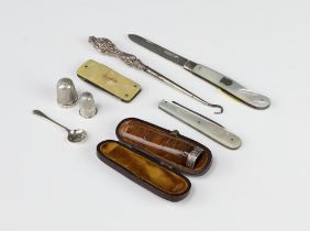 A silver and mother of pearl fruit knife Sheffield 1922, 1 other, a button hook, 2 thimbles, a spoon