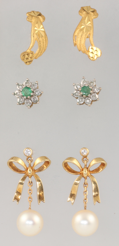 A pair of yellow metal 750 pearl ear studs 4.3 grams gross, a pair of 9ct gem set cluster earrings