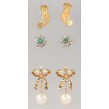 A pair of yellow metal 750 pearl ear studs 4.3 grams gross, a pair of 9ct gem set cluster earrings