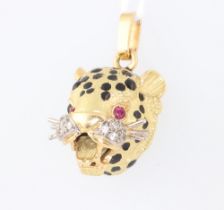 A yellow metal 750 ruby, diamond and enamelled pendant in the form of a leopards head 12.3 grams,