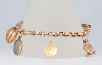 A yellow metal 9ct bracelet with 5 charms, 20cm, gross weight 19.8 grams