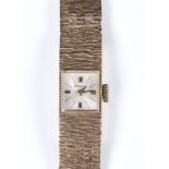 A lady's 9ct yellow gold Accurist wristwatch on a bark finished bracelet, gross weight including