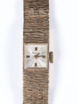 A lady's 9ct yellow gold Accurist wristwatch on a bark finished bracelet, gross weight including