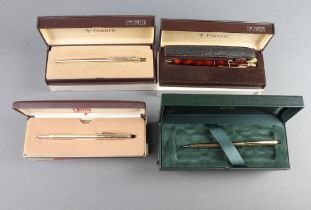 A Parker gold plated ballpoint pen, a lacquered ditto and 2 Cross ballpoint pens, all boxed