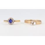 A yellow metal 18ct oval sapphire and diamond cluster ring, 2.4 grams, size J and a 9ct yellow