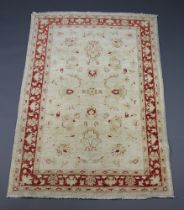 A white and brown ground Caucasian style rug 180cm x 124cmSlight staining in places