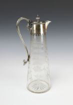 An Edwardian cut glass ewer with silver plated mounts, decorated with ferns 29cm