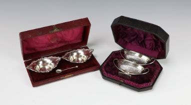 A pair of Adam style silver table salts with demi-fluted decoration Sheffield 1911, a pair of boat